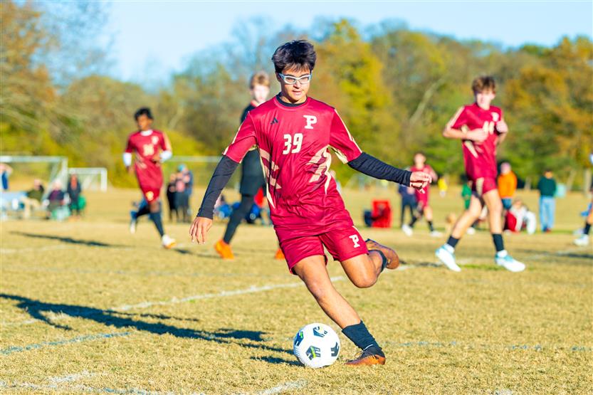 Middle school students play soccer